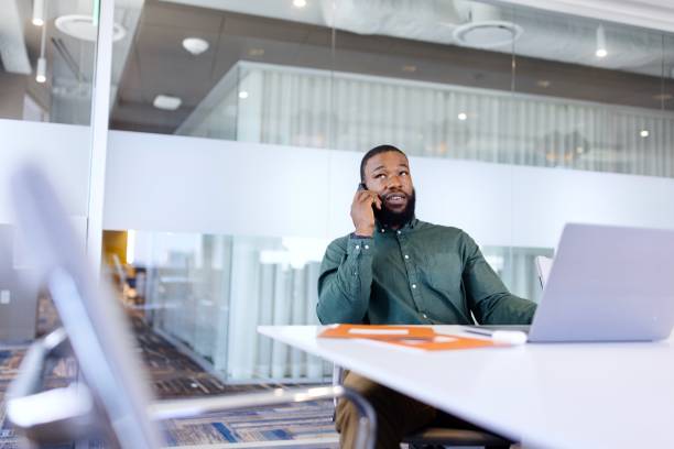 istock Businessman talking with someone while working in the office 2173306939