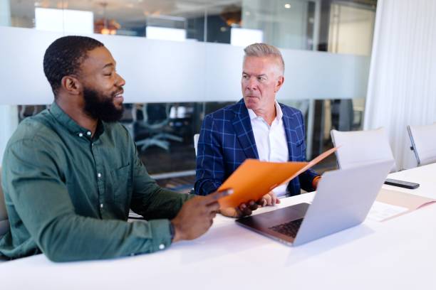 istock Modern colleagues working on a project in the office 2173307131