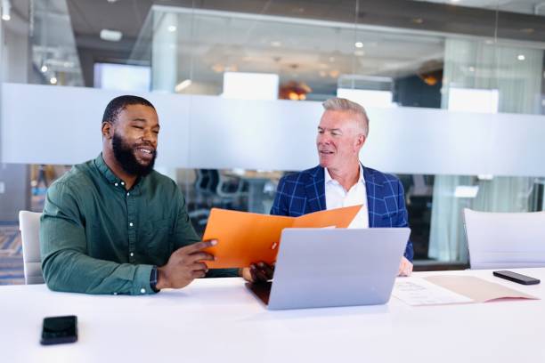 istock Man explaining something about business to his colleague during a meeting 2173307142