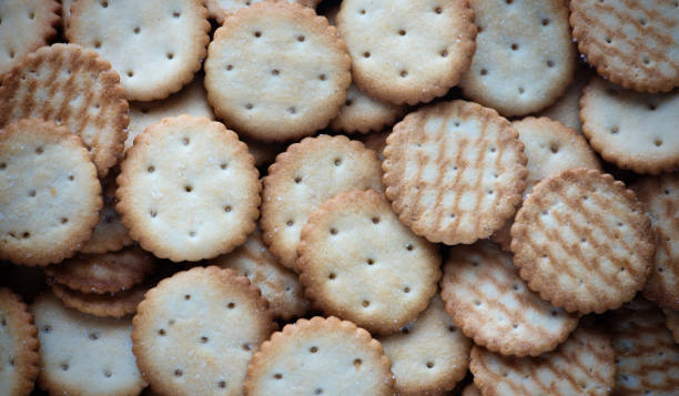 istock Tasty crackers close up in the box. Cookies background 2173316905