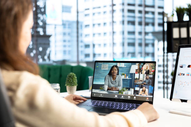 istock Determined female CEO leads a videoconference meeting with shareholders 2173321954