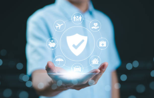 istock Comprehensive insurance coverage. protection concept. A person holds digital shield icon representing different types of insurance, including health, home, car, travel, life, protection, and security. 2173322495