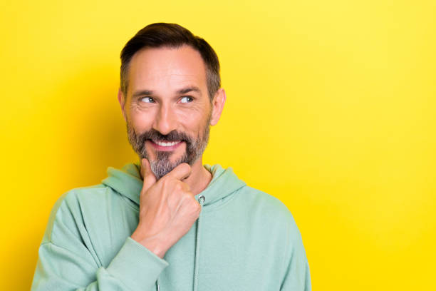 istock Closeup photo of experienced intellectual businessman touch chin look empty space solution financial problems isolated on yellow color background 2173326787