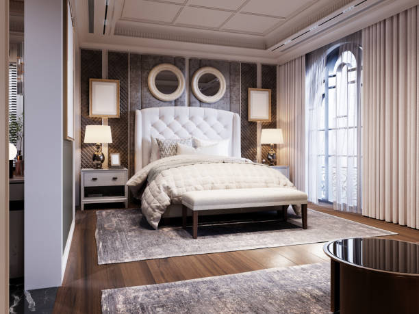 istock Elegant bedroom with a tufted headboard, quilted bedding, dual round mirrors, soft lighting, and floor-to-ceiling drapes creating a luxurious and inviting atmosphere. 2173327489