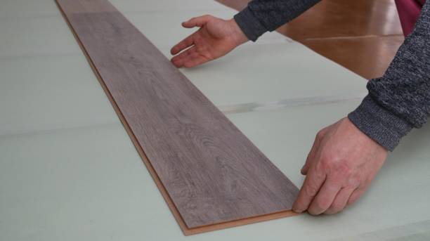 istock laying laminate flooring on underlay indoors 2173328045