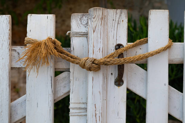 Rope tied to the garden gate.