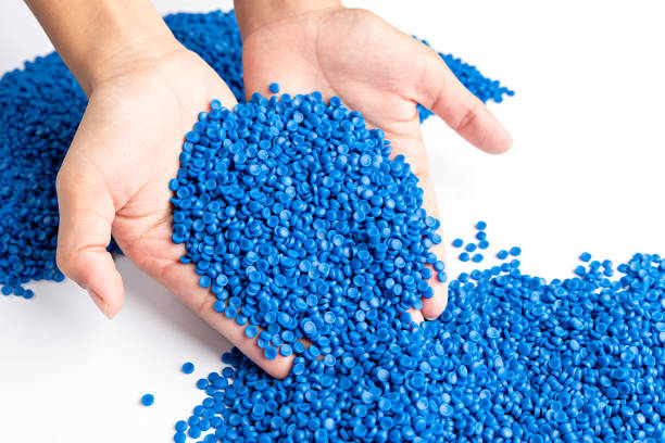 istock Blue plastic grain, plastic polymer granules,hand hold Polymer pellets, Raw materials for making water pipes, Plastics from petrochemicals and compound extrusion, resin from plant polyethylene. 2173330762