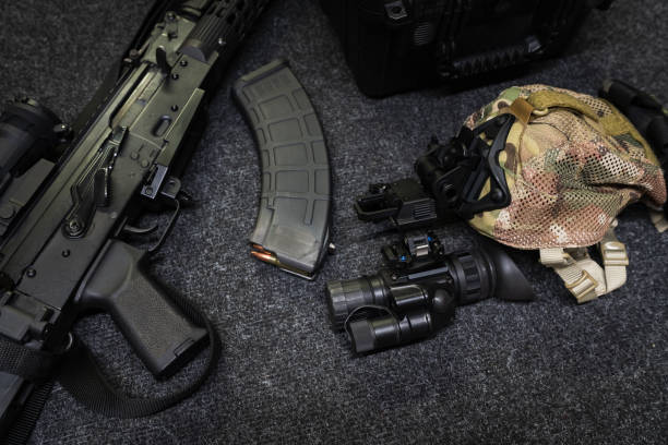 istock Tactical equipment, ak rifle, magazine and night vision monocular. 2173334606