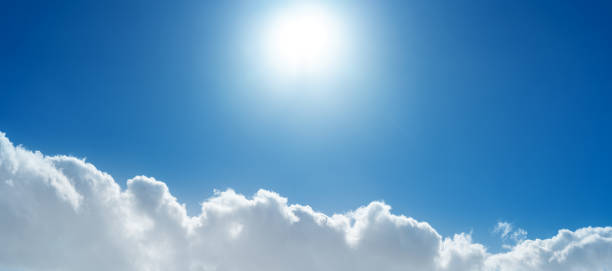 istock A serene blue sky filled with fluffy white cumulus clouds on a bright sunny day, capturing the essence of a beautiful springtime atmosphere 2173334778