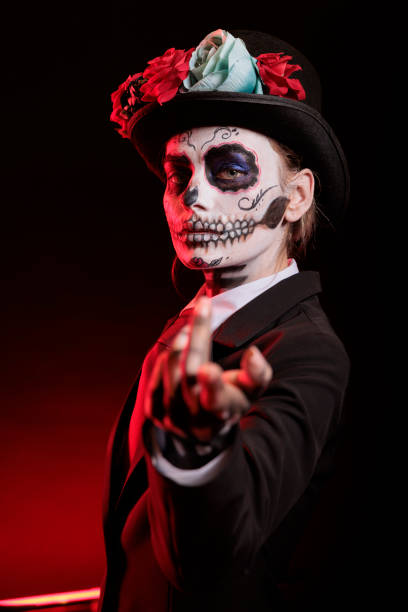 istock Woman does provocative luring gesturing, wearing skeleton makeup 2173336052