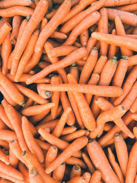 istock closeup of carrots viewed from above - vegetable background 2173341174