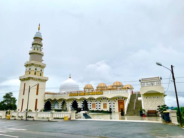 istock The mosque is white with a large minaret on top. 2173341702