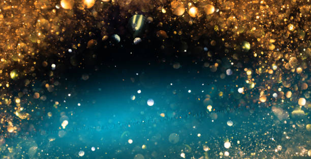 istock Abstract blur glitter effects background. Turquoise with gold color 2173342492