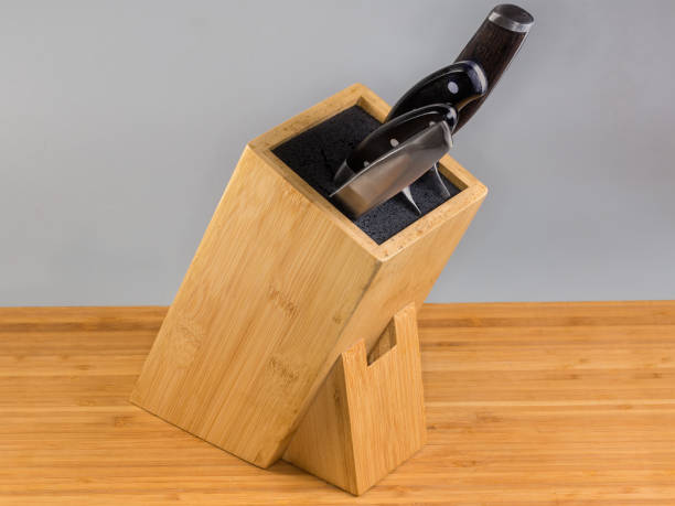 istock Inclined bamboo stand for kitchen knives on wooden surface 2173342755