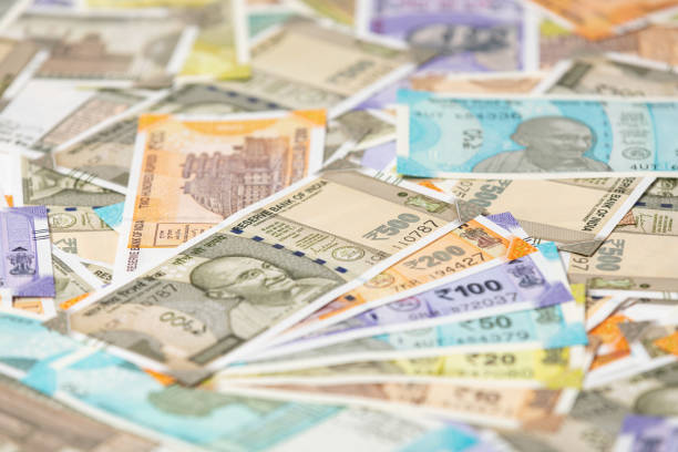 Gandhi image logo in focus over currency note.
