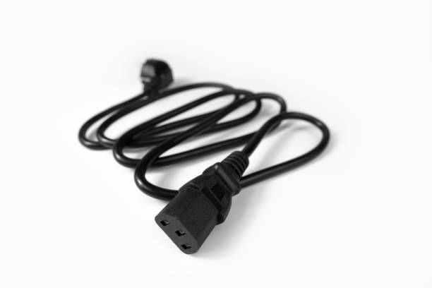 Black power cord on a computer on the white