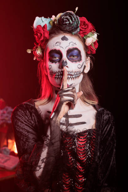 istock Mysterious lady doing quiet hand gesturing during Halloween horror event 2173363321