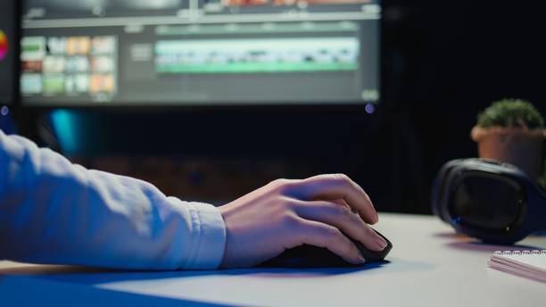 Extreme close up shot of video editor Extreme close up shot of video editor selecting key frames to use while doing video montage, working from home on computer. Woman using mouse to edit movie project footage in studio, camera B female film editor stock pictures, royalty-free photos & images