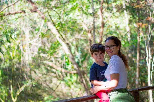 Ecotourism trip in the Atlantic forest. Family walking and having fun in the forest.