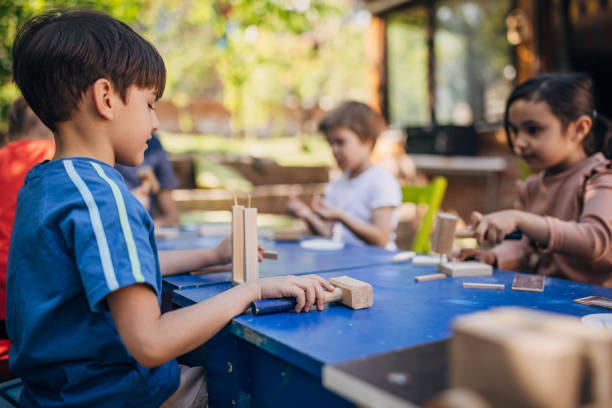istock Boys focused on building crafts under sunny sky 2173370070
