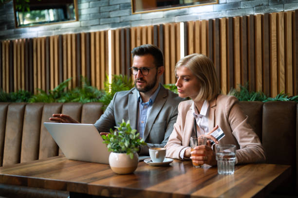 istock Business teammates making plans in a cafe 2173376234