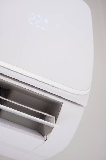 istock White home air conditioner on the wall turning on and off in 2173377585