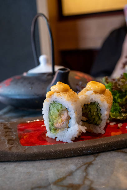 istock truffle sushi on a long plate in the restaurant 2173379980