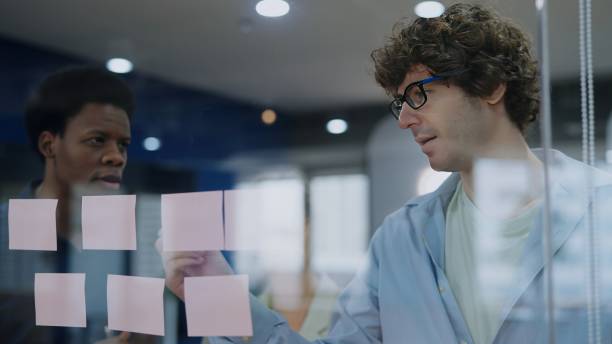 istock Present your projects with a businessman’s expertise as he navigates graphs and data sets. Witness the blend of leadership and innovation in a modern office, guiding teams toward success and strategic planning.