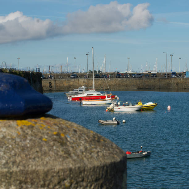 istock Boats moored with stone post in foreground 2173389143