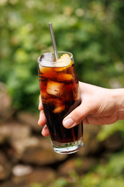 istock Soft drink cola with pickles and ice in a glass 2173390648