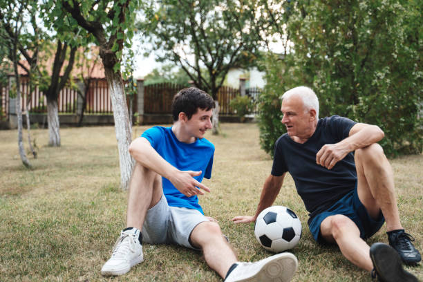 istock Relaxed conversation with soccer ball in the park. 2173390733