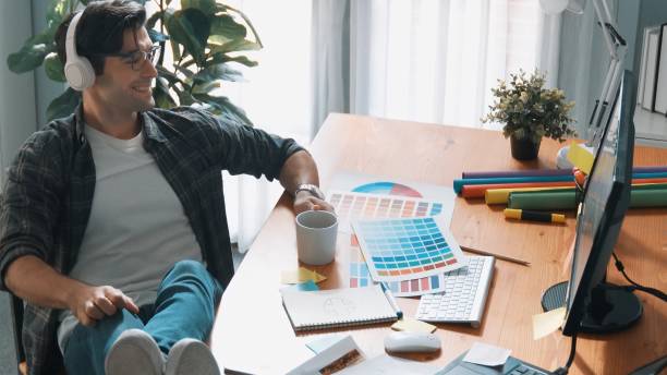 istock Top view of relaxed manager looking palettes while design color. Symposium. 2173397568