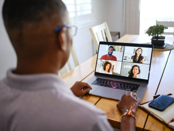 istock Mature Man on a Video Call with Co-Workers from his Home 2173397721