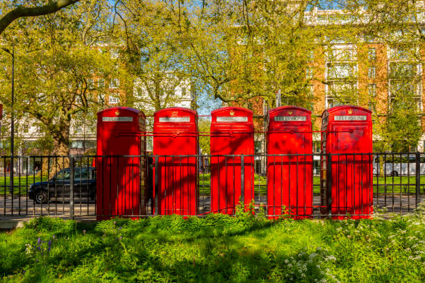 istock Five telephone boxes at Hyde park in London, UK 2173399249