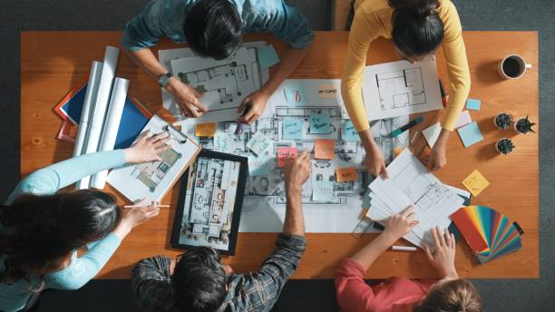 istock Top down view of designer putting hands together at meeting table. Symposium. 2173399832