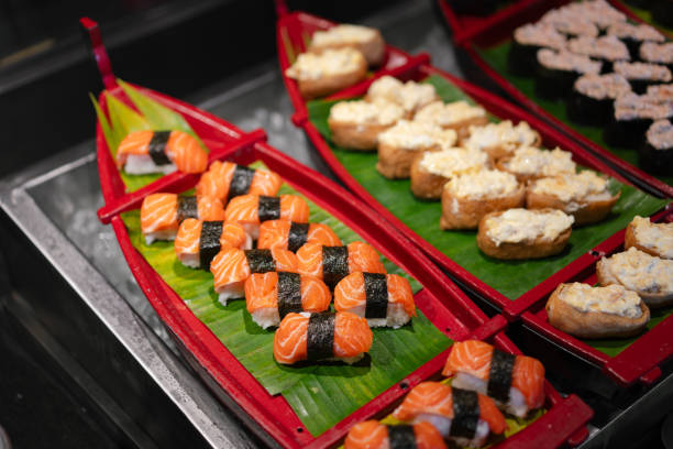 istock Buffet featuring raw salmon sushi alongside a selection of various sushi types. 2173401692