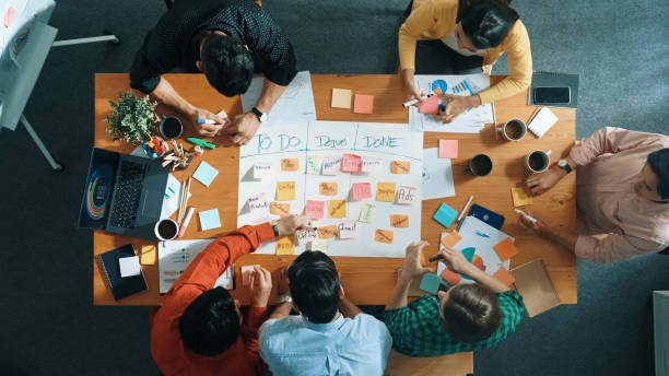 istock Top view of business team making scrum task board at meeting room. Convocation. 2173403685