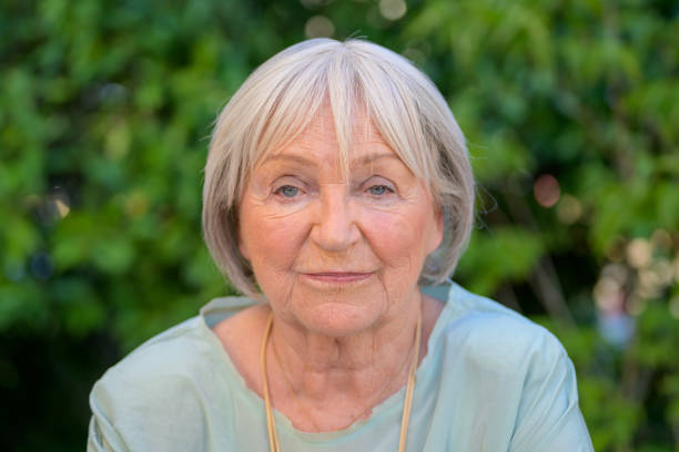 istock Elderly Woman with a Calm Expression in a Natural Setting 2173405572