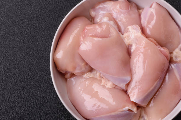 istock Fresh chicken fillet on a dark concrete table with spices and herbs 2173406413