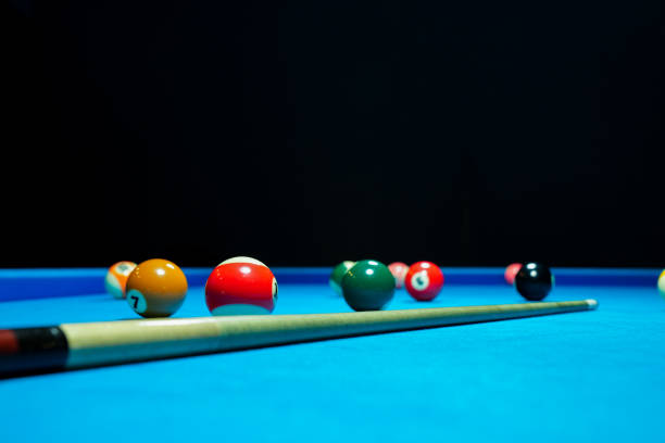 istock Billiard balls on blue table with billiard cue. Snooker, pool game 2173406696