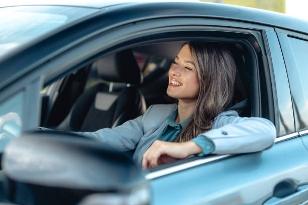 istock Beautiful woman driving modern car 2173411093