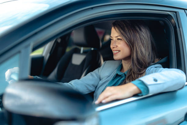 istock Beautiful woman driving modern car 2173411135