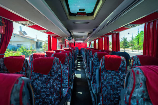 istock Interior Of An Empty Tourist Bus With Red Curtains 2173411359