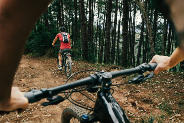 Two people cycling together in the nature