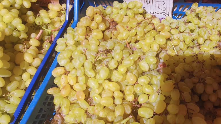 Footage of the wasps and bees over the grapes in local market stall