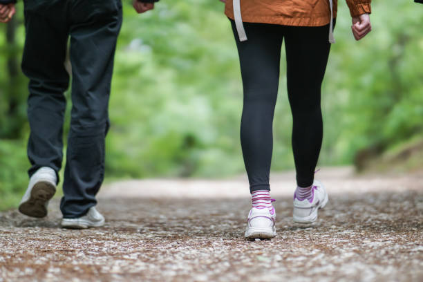 istock Father and daughter walking in nature lower body crop 2173420587
