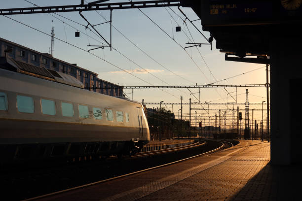 istock Train Passing Through Prague Liben Station at Sunset 2173426087