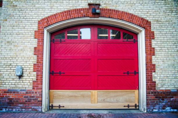 istock Vibrant Red Garage Door in Brick Wall 2173432492