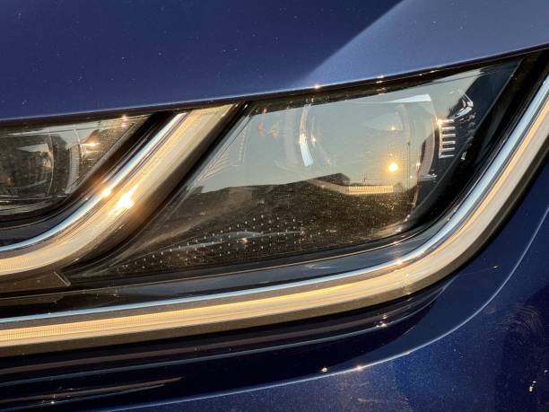 istock Close-up of car headlight with sunlight reflections 2173432602