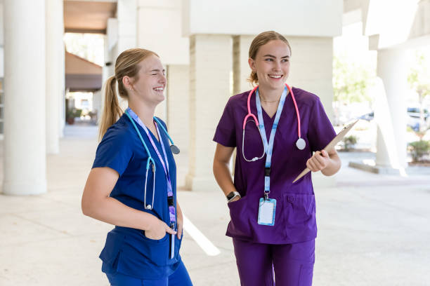 istock Young nurses talking in a hospital hallway 2173434111